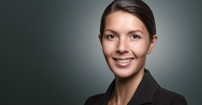 Woman with hair pulled back showing ears