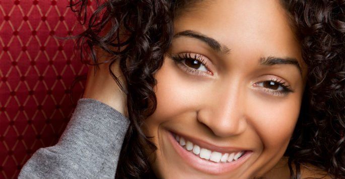 Young bllack woman smiling at camera