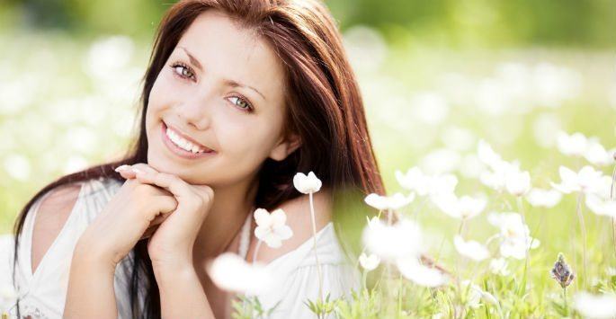 Woman in a field smiling