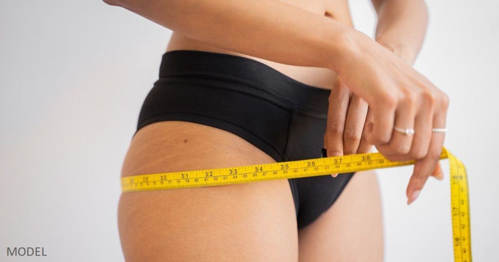 Woman considering weight loss shots to improve her body contours